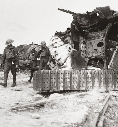 Casualties coming back from the line, pass tanks wrecked in Battle of the Tanks, Villers-Bretonneux, 24th April 1918 by English Photographer